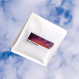 White product packaging with Blackbird branding against a blue sky background