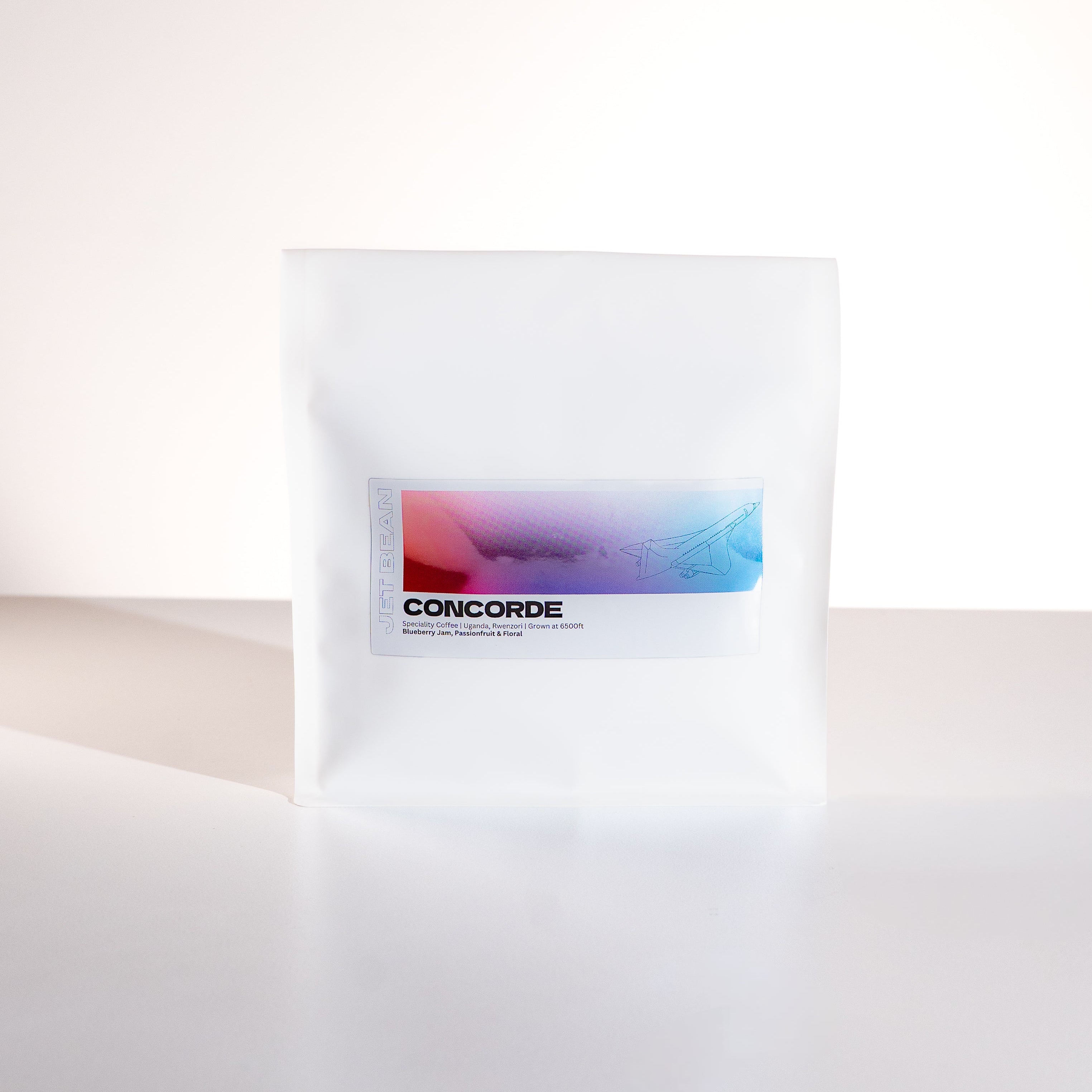 White pillow with a colorful label on a white background